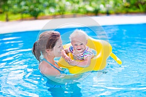 Mother and baby in swimming pool