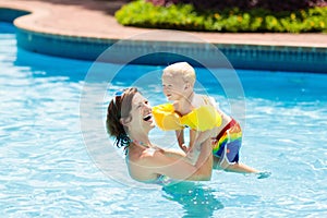 Mother and baby in swimming pool