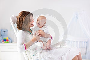 Mother and baby in white bedroom