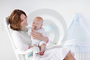 Mother and baby in white bedroom