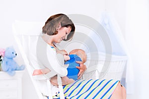 Mother and baby in white bedroom