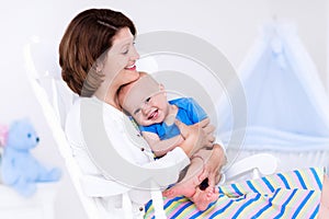 Mother and baby in white bedroom