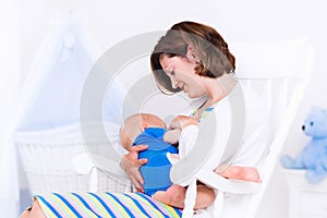 Mother and baby in white bedroom