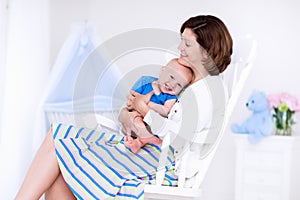 Mother and baby in white bedroom