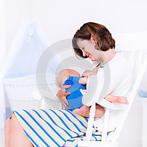 Mother and baby in white bedroom