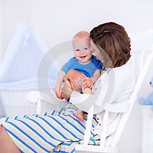 Mother and baby in white bedroom