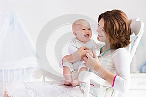 Mother and baby in white bedroom