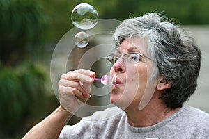 mother blowing bubbles