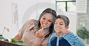 Mother, boy and brushing teeth in bathroom with mirror, morning routine and dental care with toothpaste for fresh