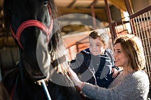 Mother and boy at a horse ranch