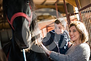 Mother and boy at a horse ranch