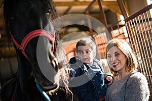 Mother and boy at a horse ranch