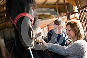 Mother and boy at a horse ranch