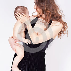 Mother breast feeding a cute baby. Newborn girl.