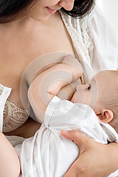 Mother breast feeding her infant