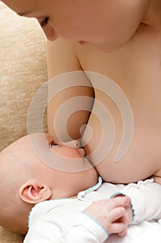 Mother breast feeding her little son