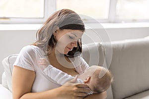 Mother Breast feeding his baby at home