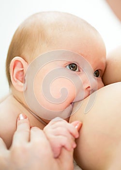 Mother breast feeding infant baby