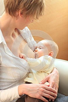 Mother breastfeeding baby photo
