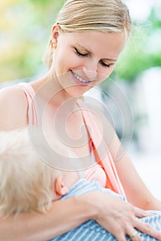 Mother Breastfeeding Baby Outdoors