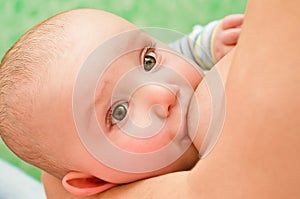 Mother breastfeeding baby photo