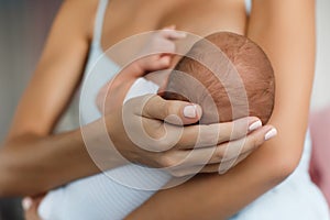 Mother breastfeeding her newborn child