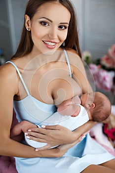 Mother breastfeeding her newborn child