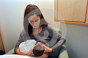 Mother Breastfeeding her Newborn photo