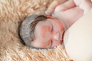 Mother breastfeeds baby. Mother breastfeeding her newborn baby beside window. Milk from mother`s breast is a natural medicine to