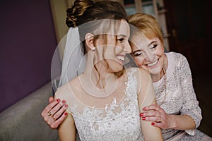 Mother of the bride blesses the bride for a happy family life.