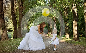 Mother bride and daughter in the park