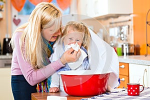 Mother care for sick child with vapor-bath