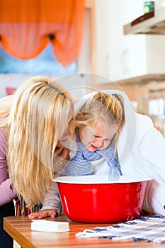 Mother care for sick child with vapor-bath