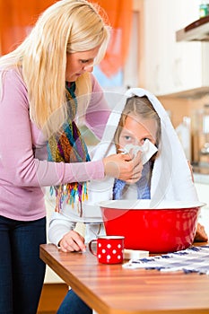 Mother care for sick child with vapor-bath