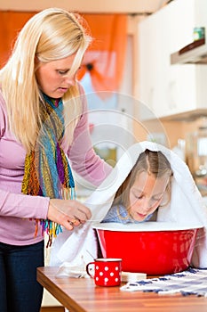 Mother care for sick child with vapor-bath photo