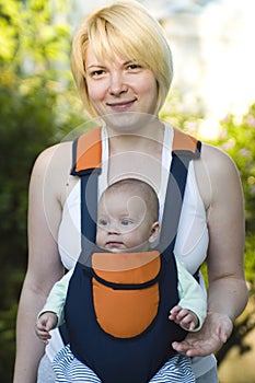 Mother carrying Baby