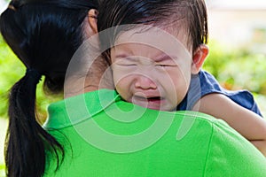 Mother carrying and comfort her daughter