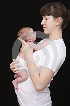 Mother Carrying Her Newborn Baby