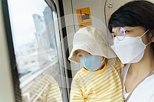 Mother carrying Son while Traveling