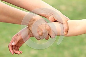 Mother catch child arm photo