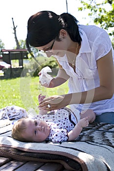 Mother changing nappy