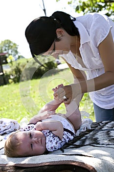 Mother changing nappy