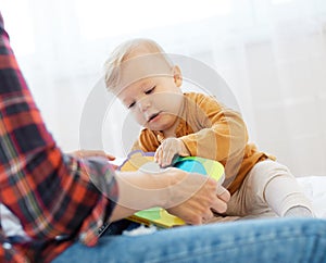 mother child baby bood reading education learning having fun family happy childhood care boy sun