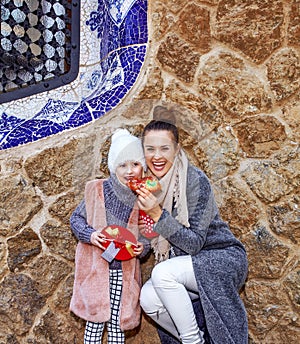 Mother and child in Barcelona eating traditional king cake