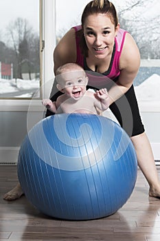 Mother with child boy doing fitness exercises