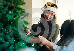 Mother, child and christmas, tree decoration and holiday celebration, happy smile and love together in home. Latino