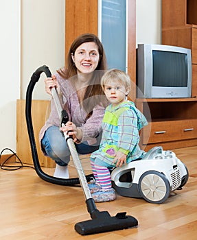 Mother with child cleaning home