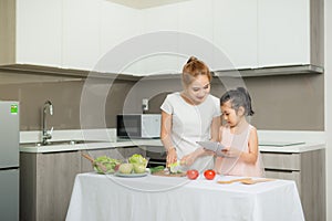Mother and child and computer use, Invented a food menu photo