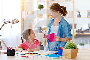 Mother and child daughter doing homework geography with globe