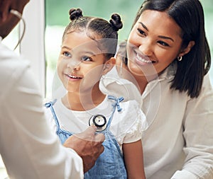 Mother, child and doctor with stethoscope for health care in a hospital for heart and lungs. African woman, pediatrician